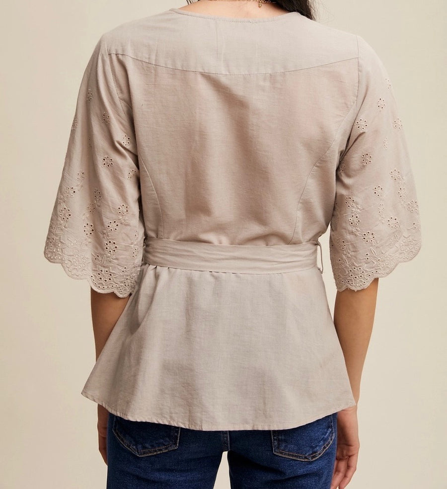 Embroidered Eyelet Wrap Peplum Top